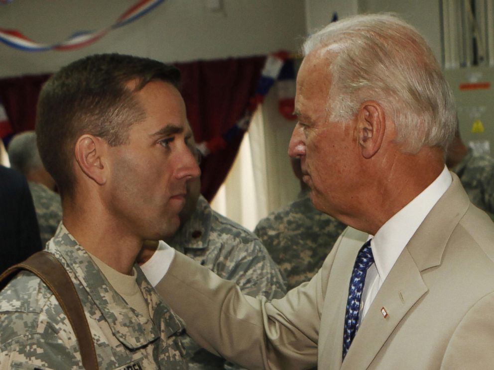 PHOTO: Vice President Joe Biden talks with his son, U.S. Army Capt. Beau Biden at Camp Victory on the outskirts of Baghdad on July 4, 2009.