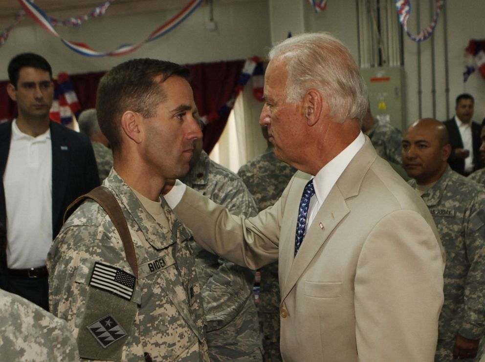 PHOTO: Vice President Joe Biden talks with his son, U.S. Army Capt. Beau Biden at Camp Victory on the outskirts of Baghdad on July 4, 2009.