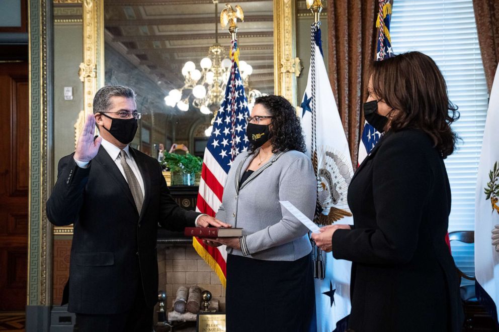 PHOTO: Vice President Kamala Harris, right, swears in Xavier Becerra, secretary of Health And Human Services (HHS), beside his wife Dr. Carolina Reyes during a ceremony in the Eisenhower Executive Office Building in Washington, D.C., March 26, 2021.