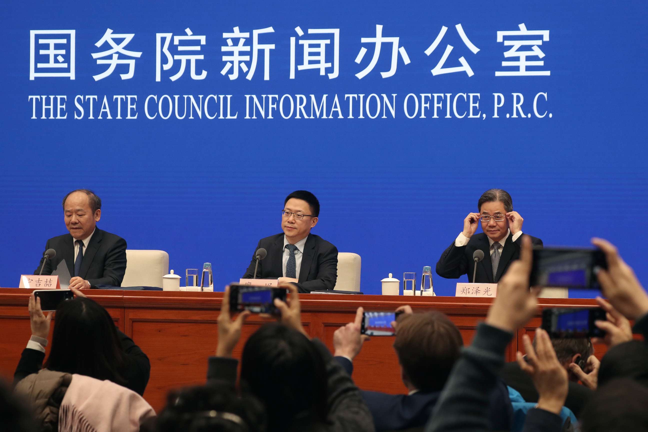 PHOTO: Chinese officials, from left, Ning Jizhe, Liao Min, and Zheng Zeguang, give a press conference on the trade deal with the United States in Beijing, Dec. 13, 2019.