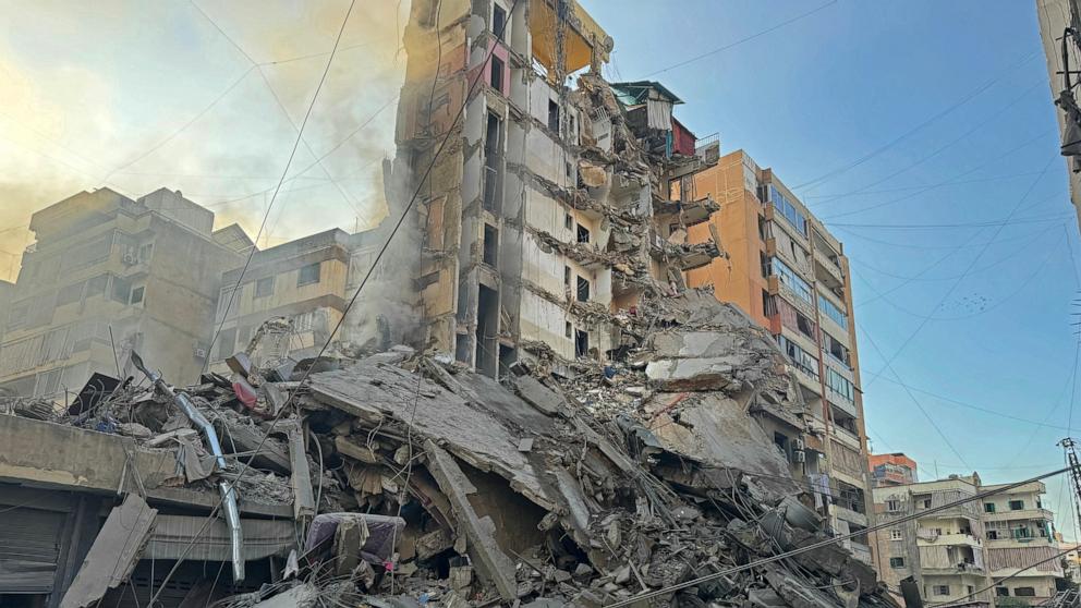 PHOTO: A man inspects the debris of destroyed buildings at the site of an Israeli airstrike that targeted Haret Hreik neighbourhood in Beirut's southern suburbs, on March 7, 2026. 