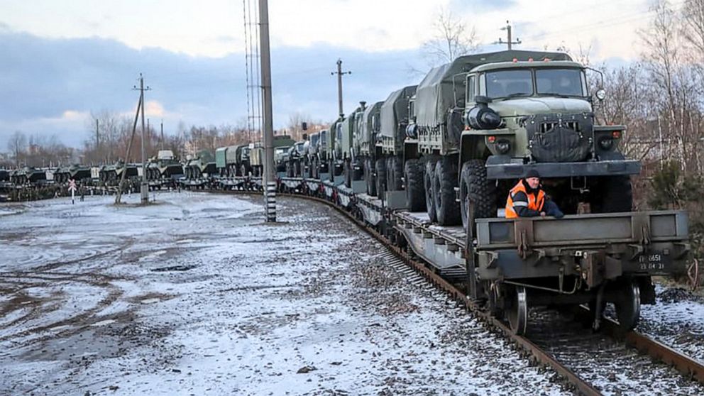 PHOTO: This handout photograph released on Jan. 18, 2022 by Belarus' Defense Ministry, shows a Russian troop train transporting military vehicles arriving for drills in Belarus. 