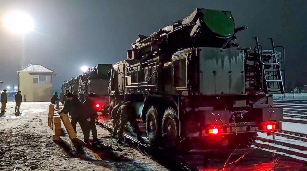 PHOTO: In this photo taken from video provided by the Russian Defense Ministry Press Service on Jan. 29, 2022, Russian military vehicles prepares to drive off a railway platforms after arrival in Belarus.