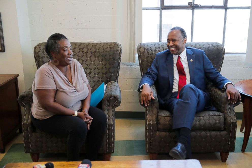 PHOTO: Housing and Urban Development Secretary Ben Carson, right, smiles while listening to Denise Smith, who used to be homeless, at the Downtown Women's Center, April 24, 2018, in Los Angeles.