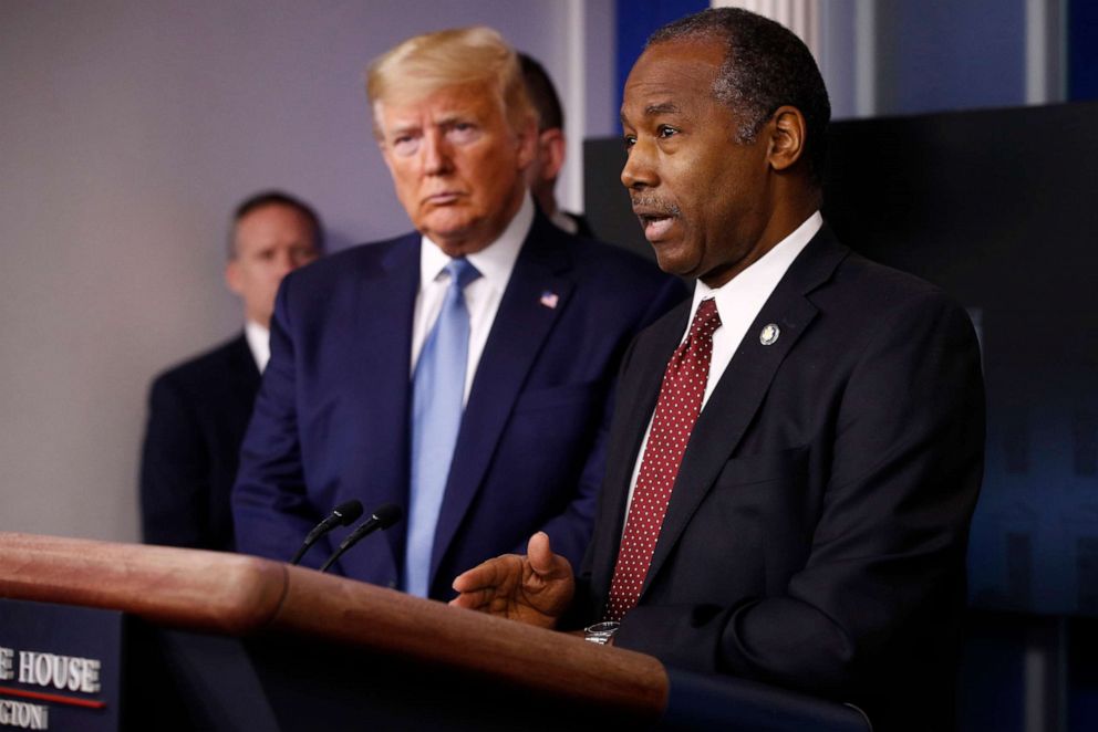 PHOTO: In this March 21, 2020, file photo, President Donald Trump listens as Housing and Urban Development Secretary Ben Carson speaks during a coronavirus task force briefing at the White House in Washington.