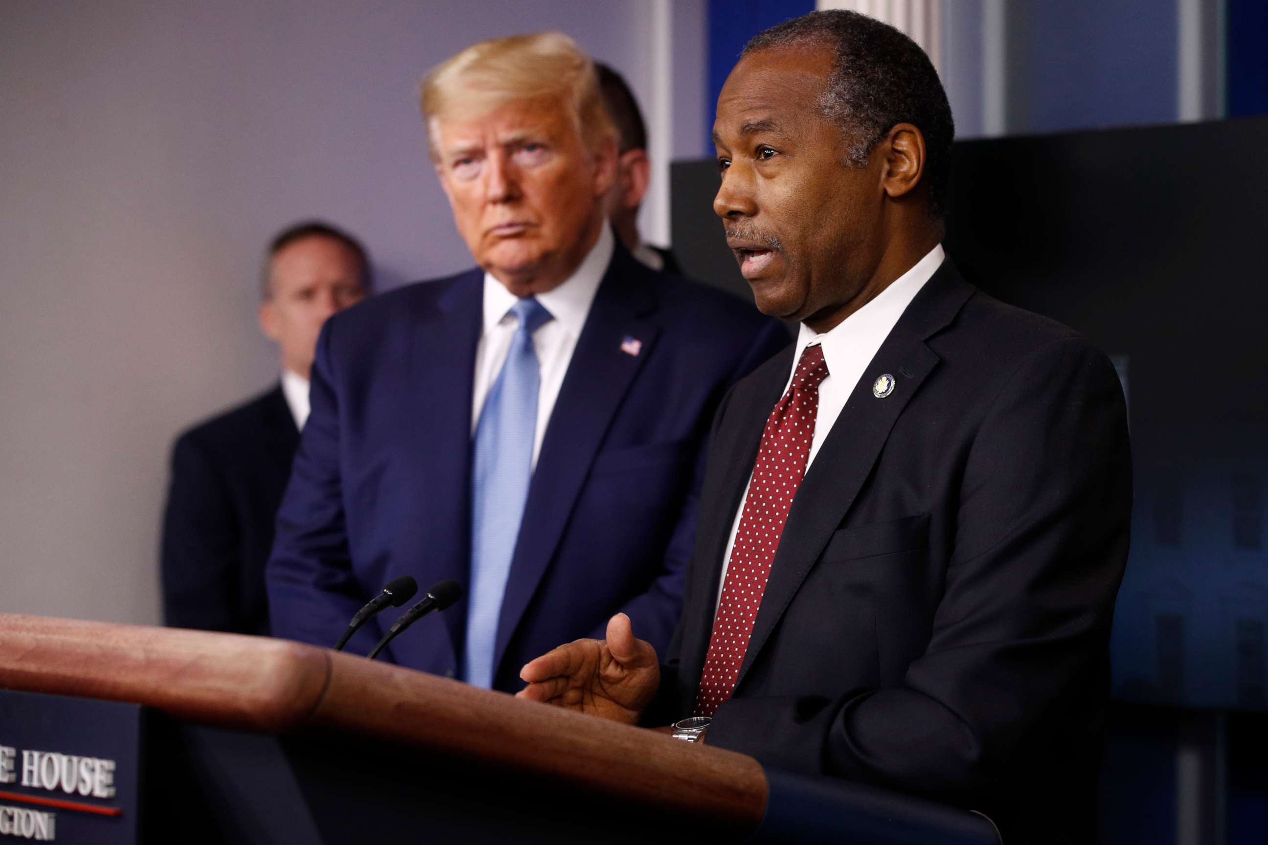PHOTO: President Donald Trump listens as Housing and Urban Development Secretary Ben Carson speaks during a coronavirus task force briefing at the White House, Saturday, March 21, 2020, in Washington.