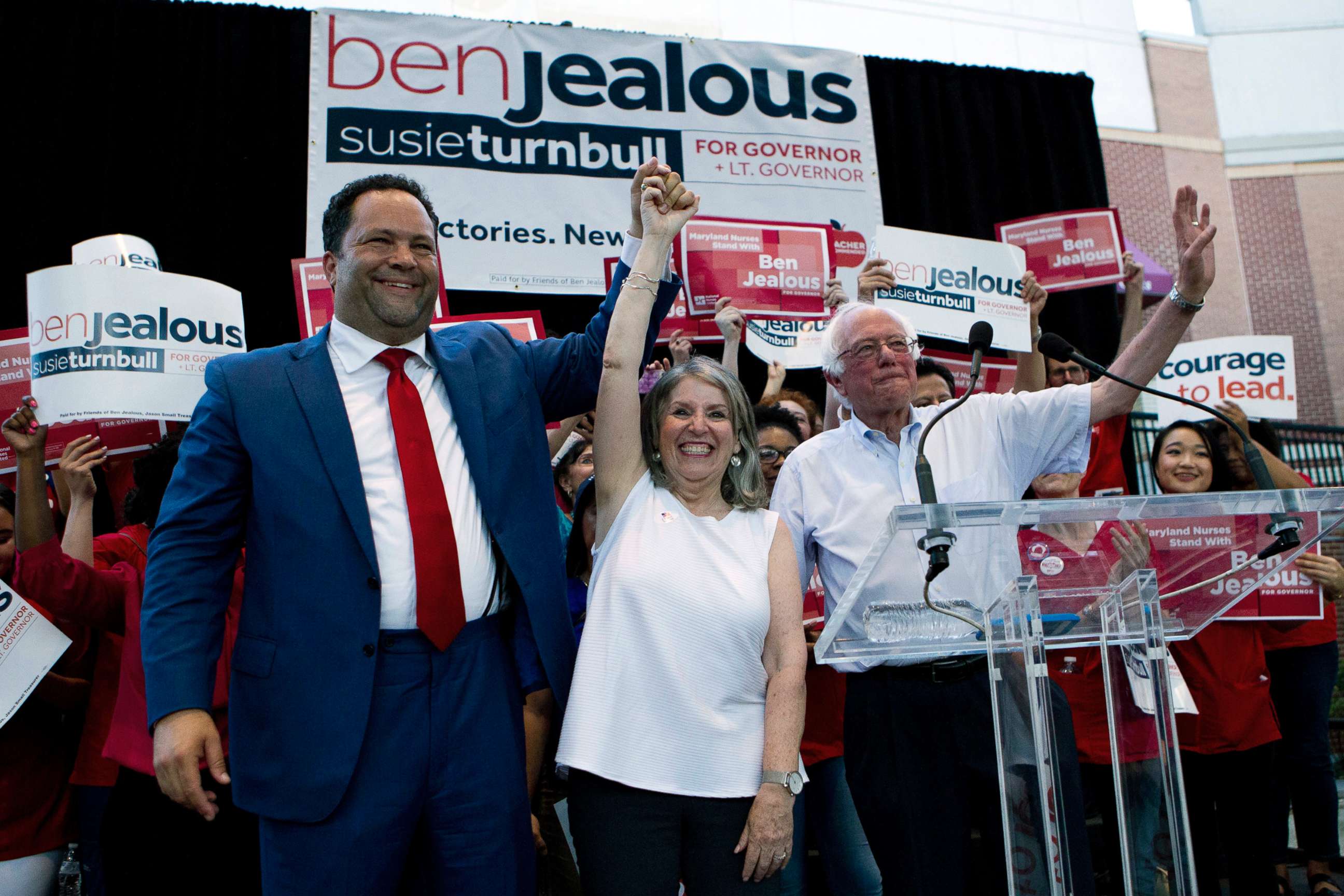PHOTO: From left, Democrat Ben Jealous raises the hand of his running mate Susie Turnbull while Sen. Bernie Sanders waves during a gubernatorial campaign rally in Maryland's Democratic primary in downtown Silver Spring, Md., June 18, 2018.