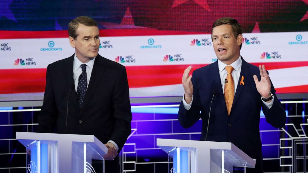 PHOTO: Michael Bennet and Eric Swalwell participate in the second night of the first 2020 democratic presidential debate at the Adrienne Arsht Center for the Performing Arts in Miami, June 27, 2019.