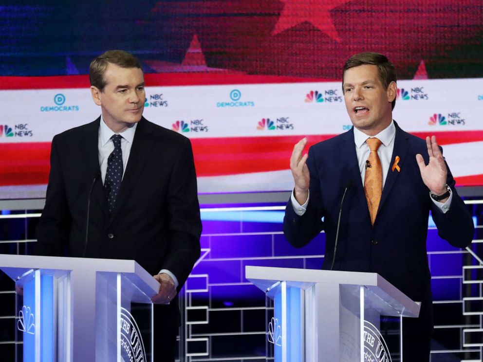 PHOTO: Michael Bennet and Eric Swalwell participate in the second night of the first 2020 democratic presidential debate at the Adrienne Arsht Center for the Performing Arts in Miami, June 27, 2019.