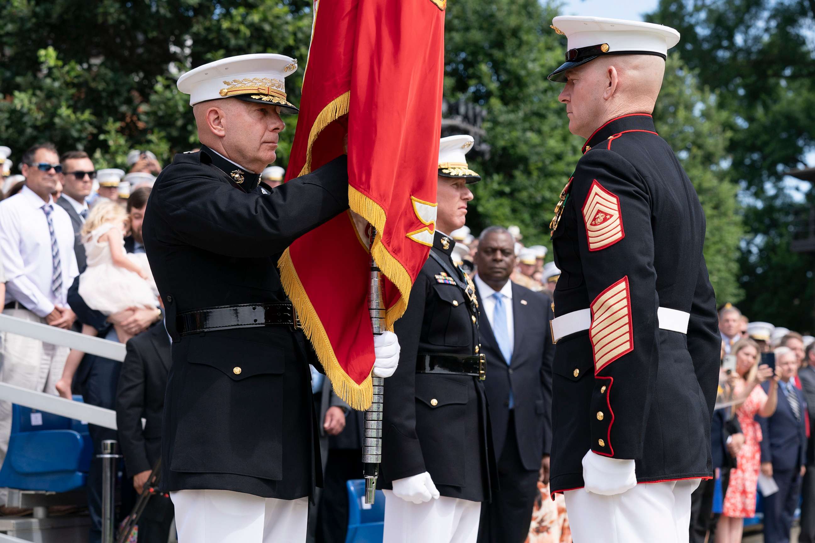 PHOTO: U.S. Marine Corps Gen. David Berger, left, holds the battle colors during a relinquishment of office ceremony, July 10, 2023, at the Marine Barracks in Washington, D.C.