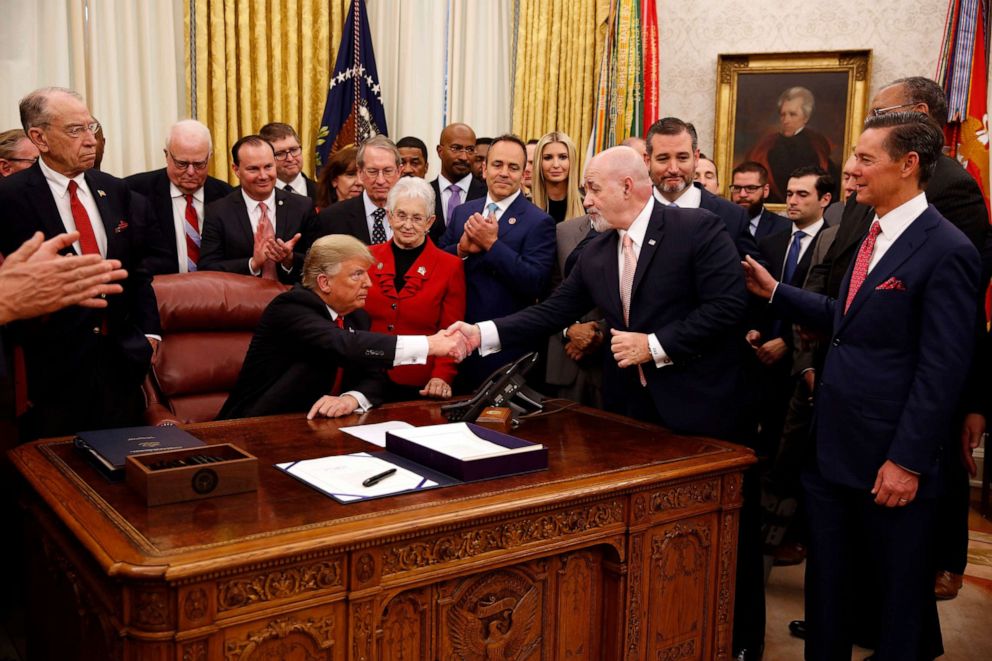 PHOTO: Bernard Kerik, former New York City Police Commissioner, shakes hands with President Donald Trump during a signing ceremony for a juvenile justice reform act in the Oval Office of the White House, in Washington, Dec. 21, 2018.