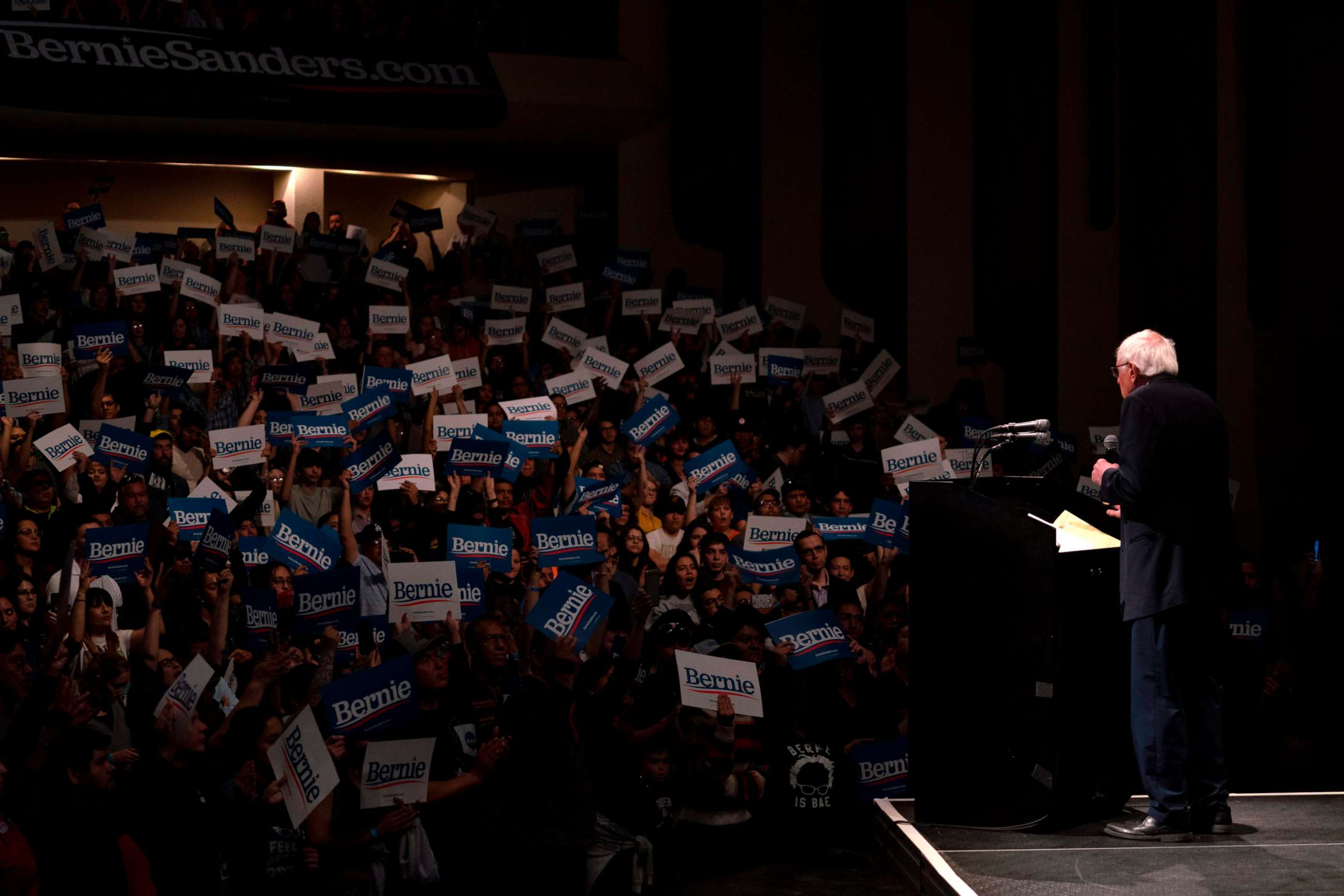 PHOTO: Supporters hold up placards as Democratic presidential hopeful Vermont Senator Bernie Sanders speaks during a rally at the Abraham Chavez Theater on February 22, 2020 in El Paso, Texas.