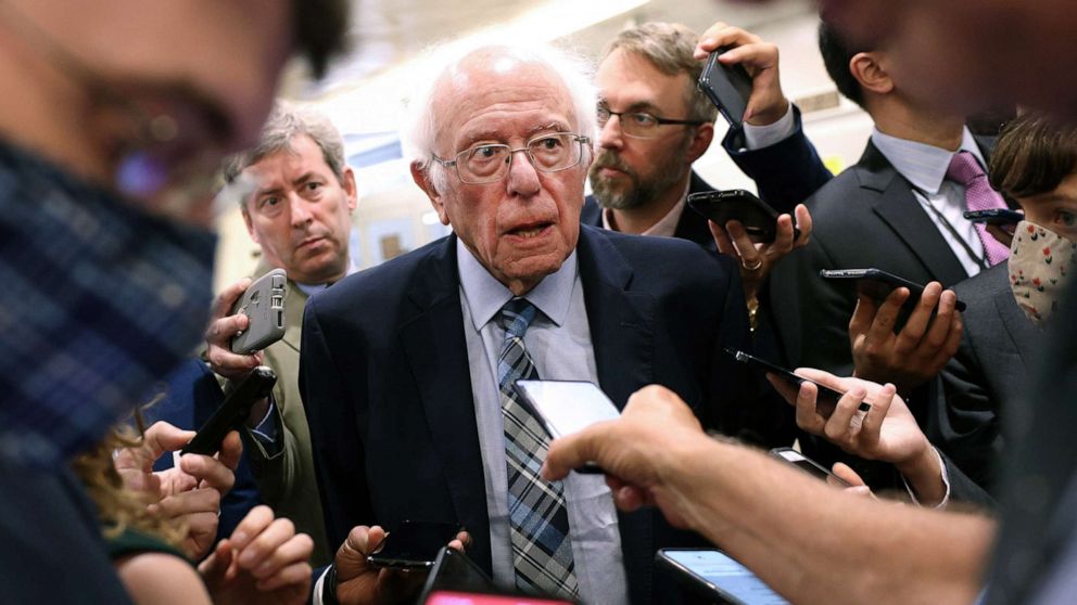 PHOTO: Sen. Bernie Sanders talks to reporters as he walks to a vote at the U.S. Capitol on July 21, 2021 in Washington, D.C. The Senate is expected to hold a cloture vote on the bipartisan infrastructure bill. 