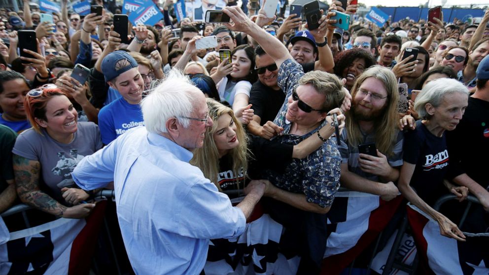 PHOTO: Democratic presidential candidate Senator Bernie Sanders poses for a picture with supporters during a Get Out the Early Vote campaign rally in Santa Ana, Calif., Feb. 21, 2020.