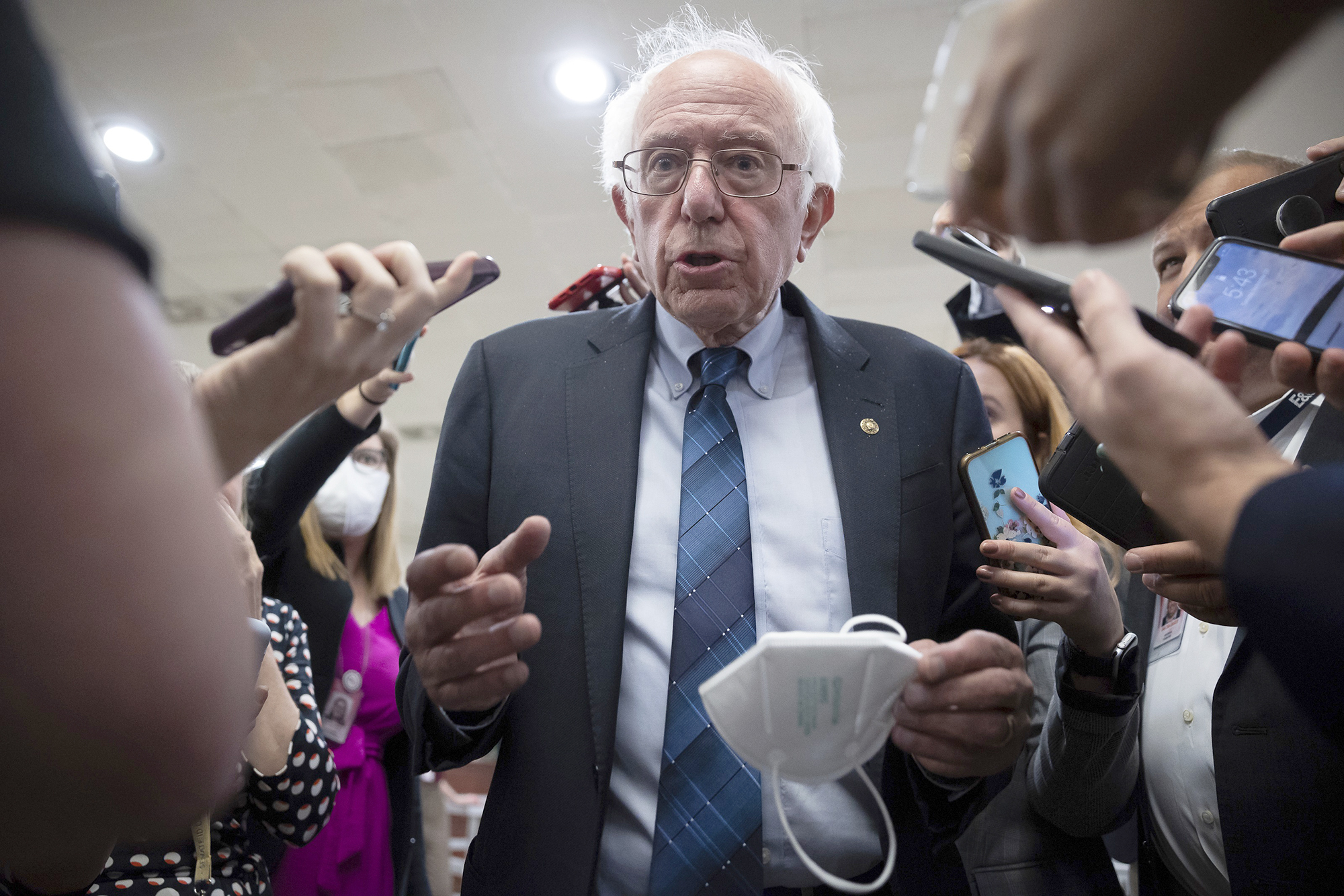 PHOTO: Sen. Bernie Sanders speaks with reporters on his way to a vote at the U.S. Capitol, Sept. 27, 2022. 