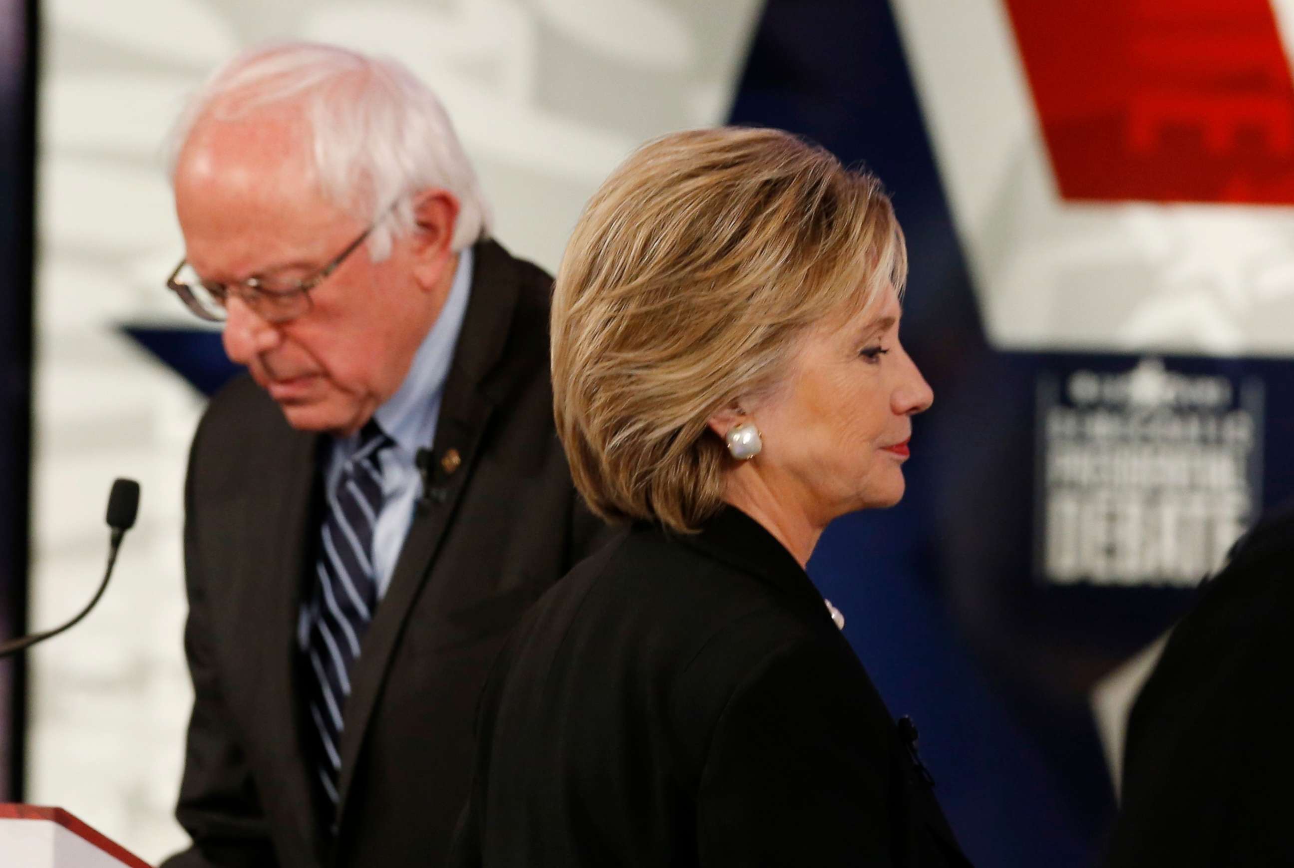 PHOTO: Former Secretary of State Hillary Clinton walks past fellow candidate and Senator Bernie Sanders during a break at the second official 2016 U.S. Democratic presidential candidates debate in Des Moines, Iowa, Nov. 14, 2015.