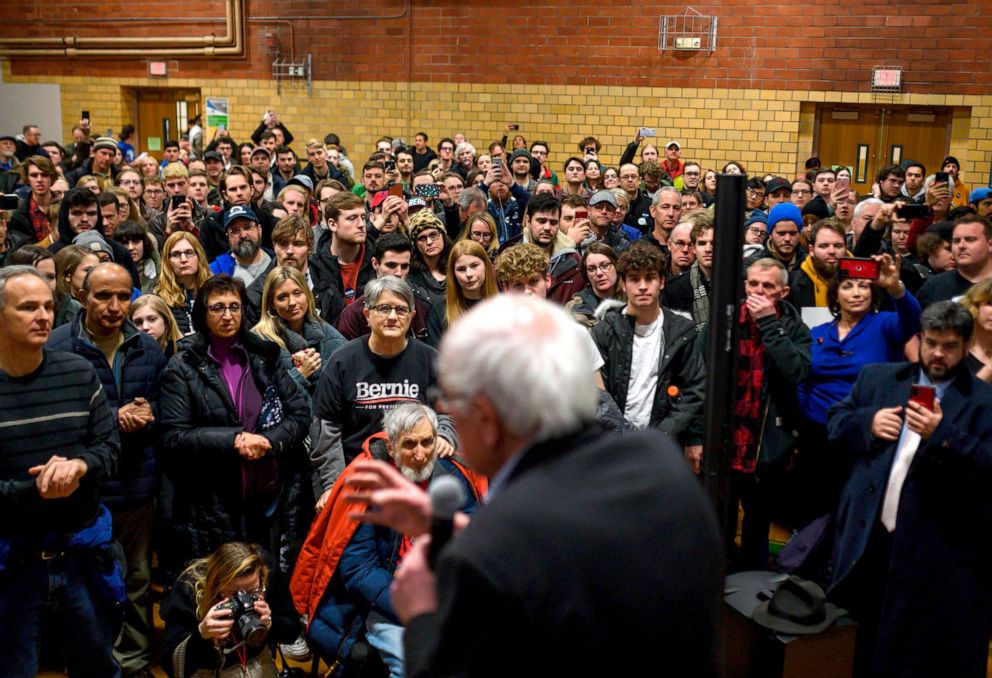 PHOTO: Supporters listen as Democratic presidential candidate Senator Bernie Sanders speaks at a campaign stop in Ames, Iowa, Jan. 25, 2020.