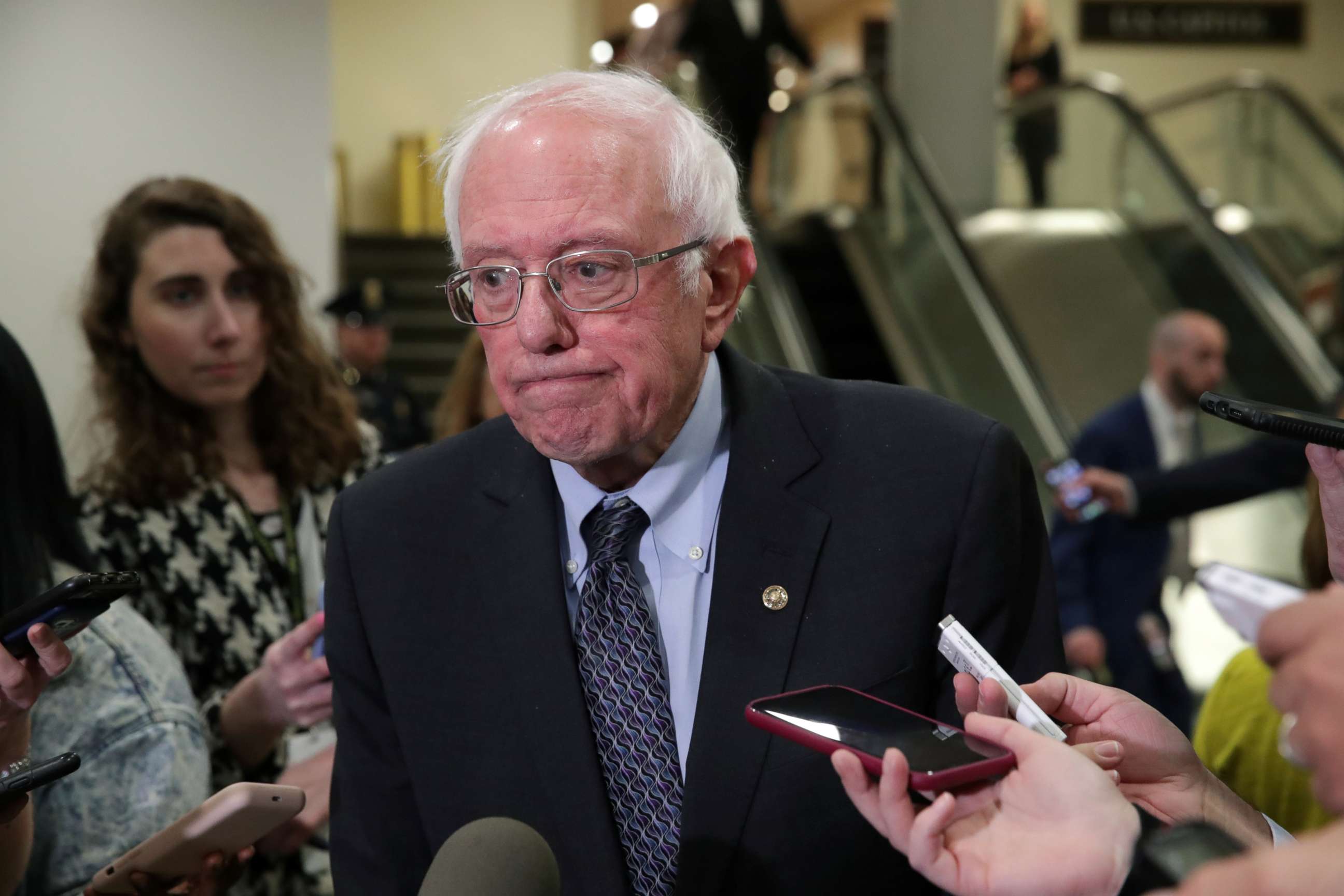 PHOTO: Sen. Bernie Sanders talks to reporters during a break in the procedural start of the Senate impeachment trial of President Donald Trump at the Capitol in Washington, Jan. 16, 2020.