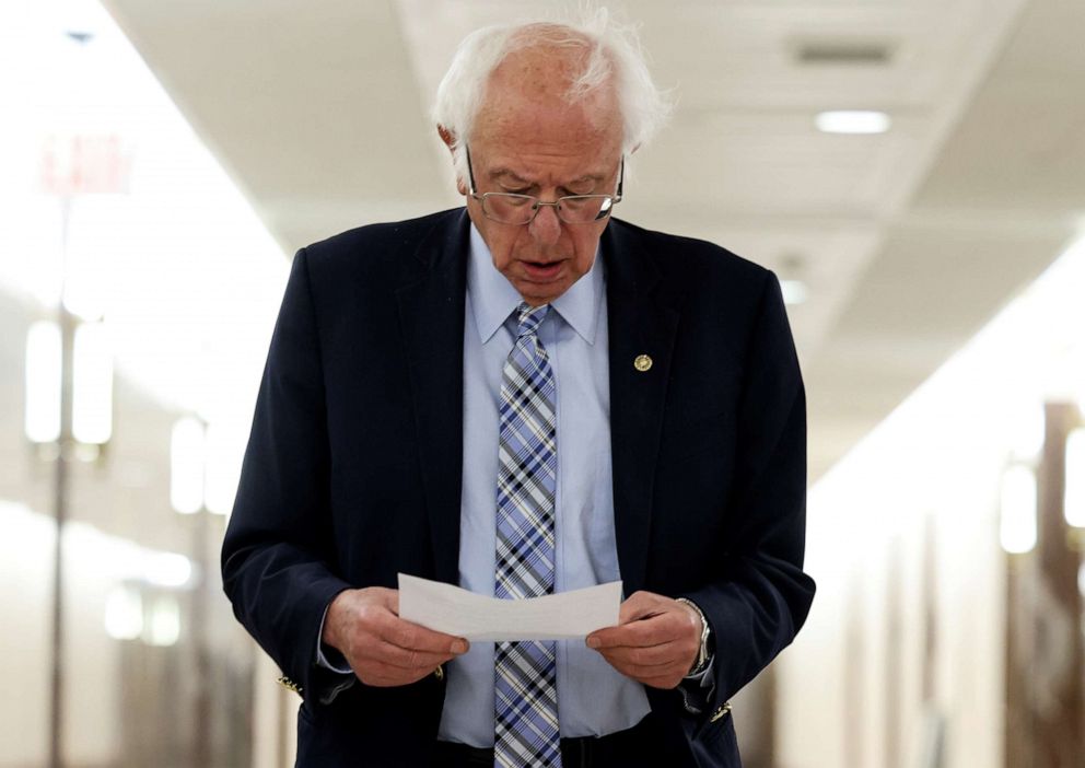 PHOTO: Senator Bernie Sanders walks through a hallway while attending Senate committee meetings on Capitol Hill in Washington, June 15, 2021.