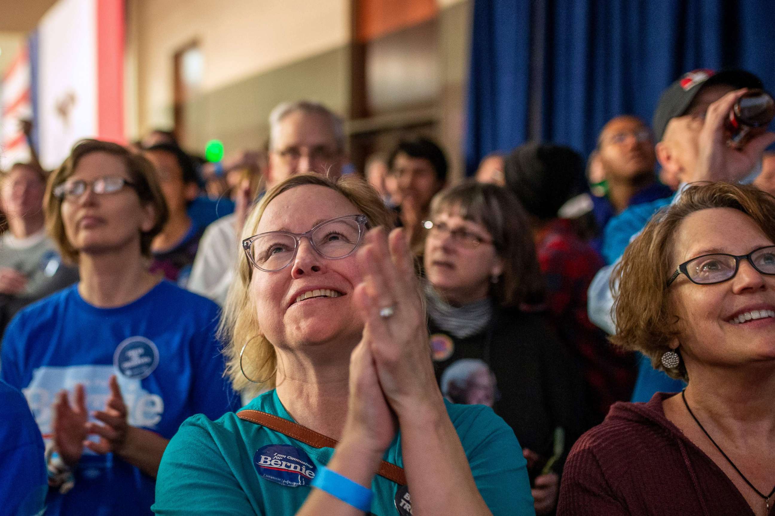 PHOTO: Supporters of democratic presidential candidate Vermont Sen. Bernie Sanders wait for results to come in at his caucus night watch party on Feb. 3, 2020, in Des Moines, Iowa.