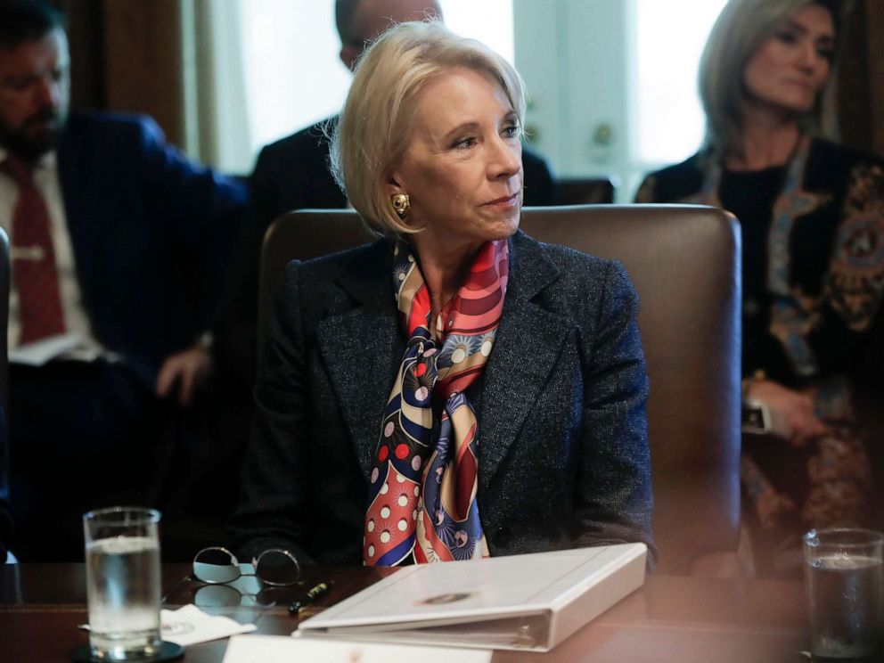 PHOTO: Education Secretary Betsy DeVos listens to President Donald Trump during a Cabinet meeting in the Cabinet Room of the White House in Washington, Oct. 21, 2019.