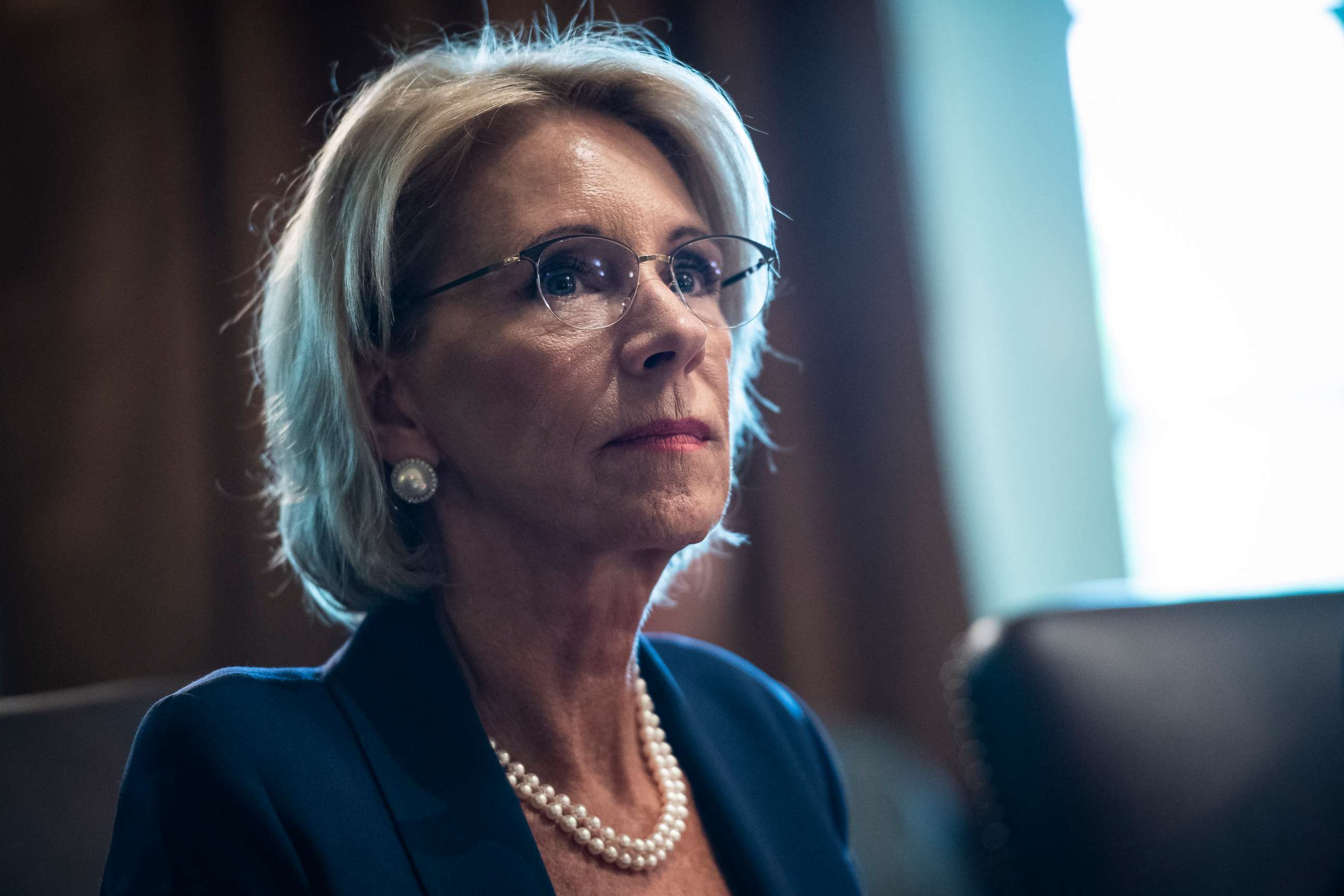PHOTO: Secretary of Education Betsy DeVos listens as President Donald J. Trump speaks during a Cabinet meeting in the Cabinet Room of the White House on Thursday, Aug 16, 2018 in Washington.