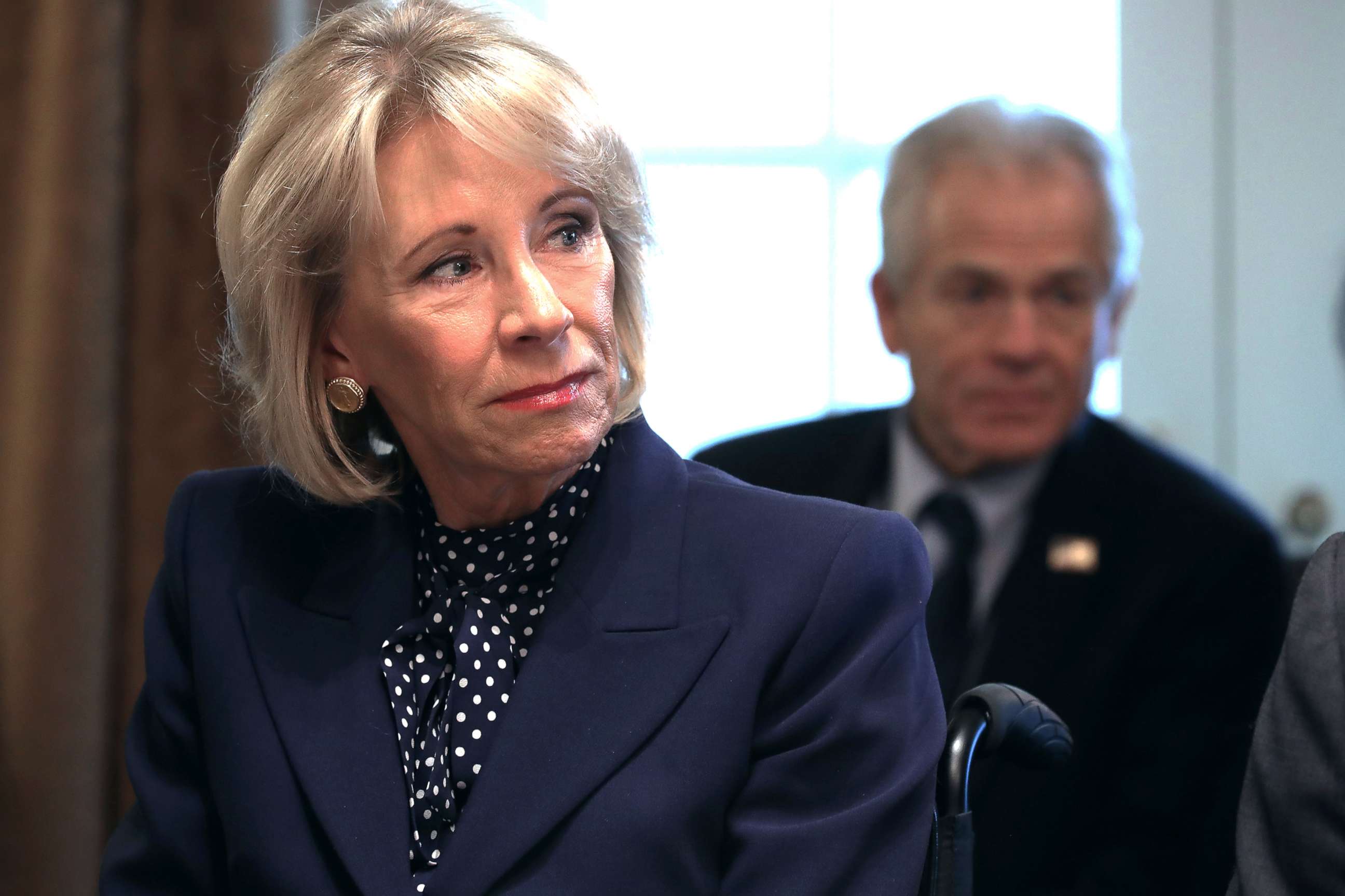 PHOTO: Education Secretary Betsy DeVos listens to U.S. President Donald Trump talk to reporters during a cabinet meeting at the White House in Washington, D.C., Feb. 12, 2019.