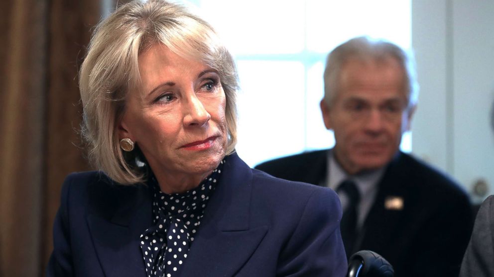 PHOTO: Education Secretary Betsy DeVos listens to U.S. President Donald Trump talk to reporters during a cabinet meeting at the White House in Washington, D.C., Feb. 12, 2019.