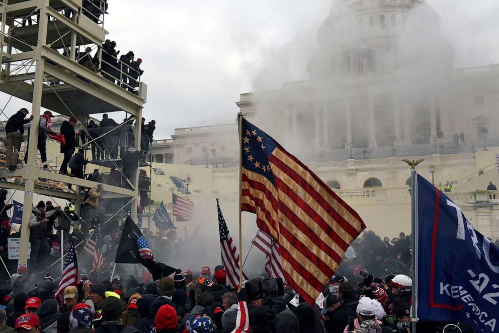 PHOTO: Supporters of President Donald Trump carry the Betsy Ross flag during the siege of  the U.S. Capitol Building in Washington, D.C., Jan. 6, 2021.