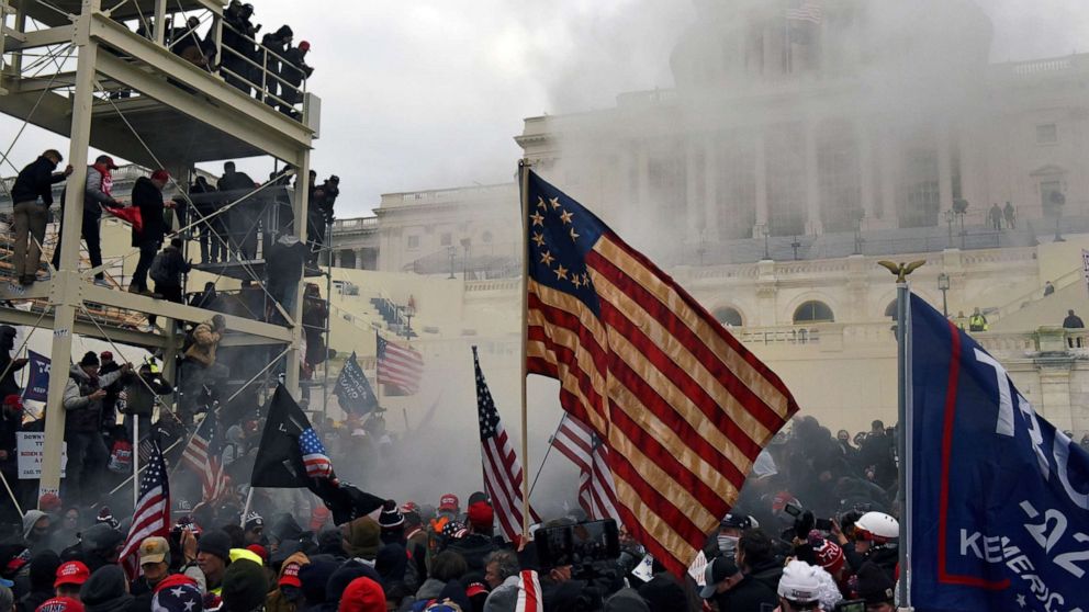 PHOTO: Supporters of President Donald Trump carry the Betsy Ross flag during the siege of  the U.S. Capitol Building in Washington, D.C., Jan. 6, 2021.