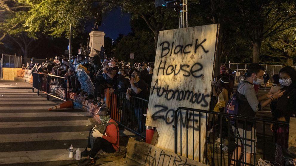 PHOTO: U.S. Park Police keeps protesters away after they attempted to pull down the statue of Andrew Jackson in Lafayette Square near the White House, June 22, 2020 in Washington, D.C.