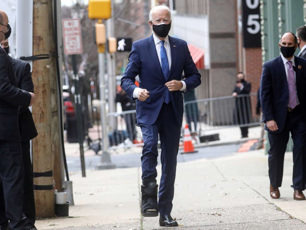 PHOTO: U.S. President-elect Joe Biden, wearing an orthotic boot to protect his injured foot, arrives to announce nominees and appointees to serve on his economic policy team at his transition headquarters in Wilmington, Del.,  Dec. 1, 2020.