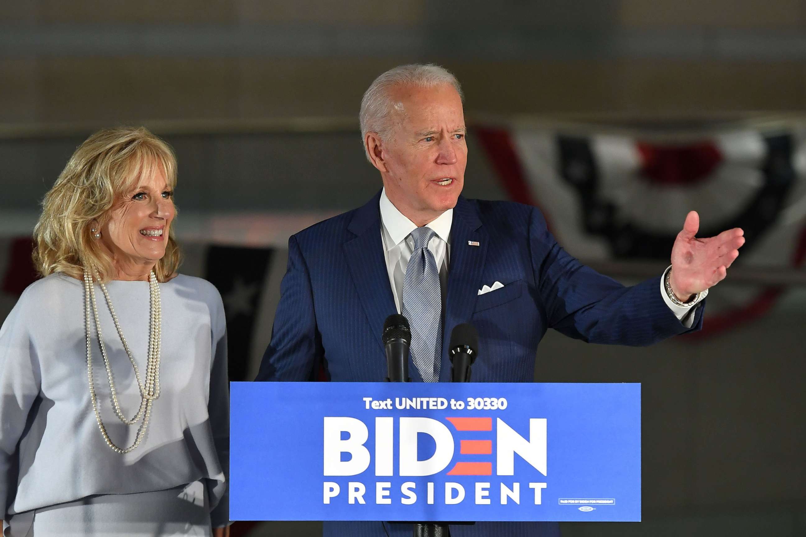 PHOTO: Democratic presidential hopeful former Vice President Joe Biden speaks, flanked by his wife Jill Biden, at the National Constitution Center in Philadelphia, March 10, 2020.