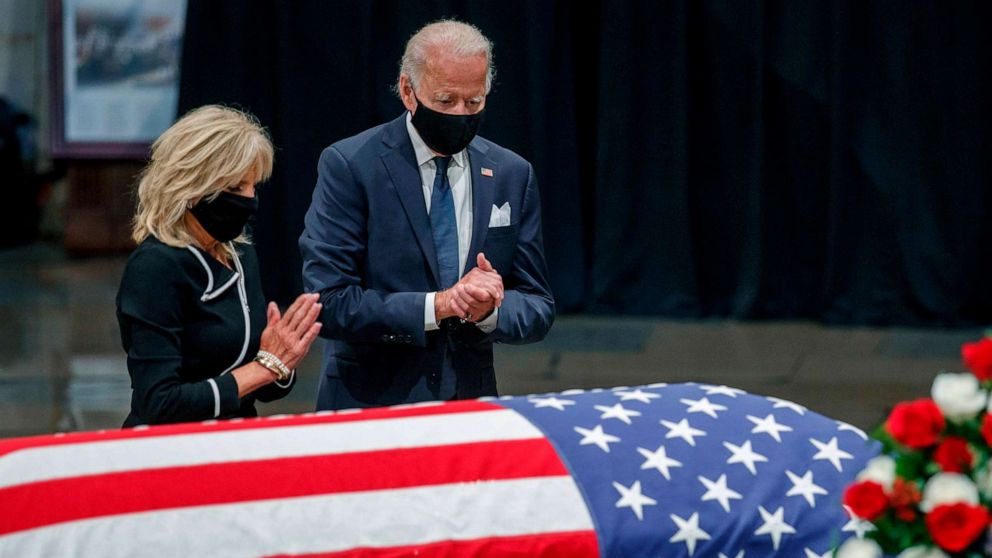 PHOTO: Former Vice President and Democratic presidential candidate Joe Biden and Jill Biden pay their respects to US Representative from Georgia John Lewis following a memorial service in the Rotunda of the Capitol in Washington, D.C., July 27 2020