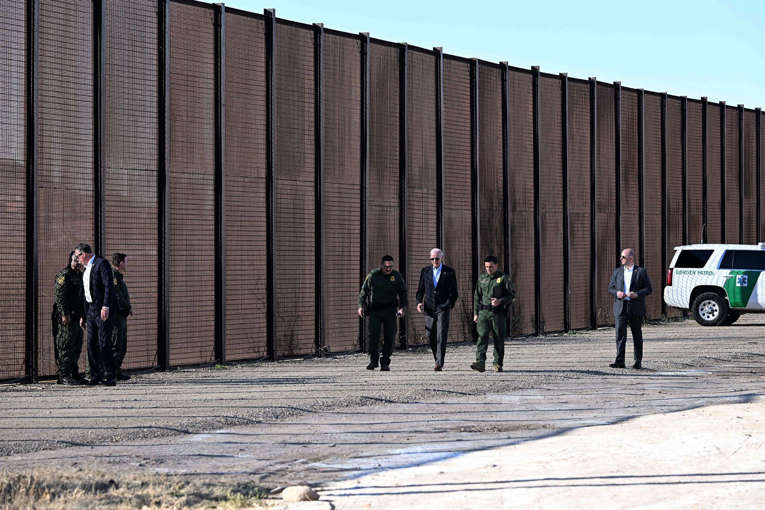 PHOTO: President Joe Biden speaks with members of the US Border Patrol as they walk along the US-Mexico border fence in El Paso, Texas, Jan. 8, 2023.