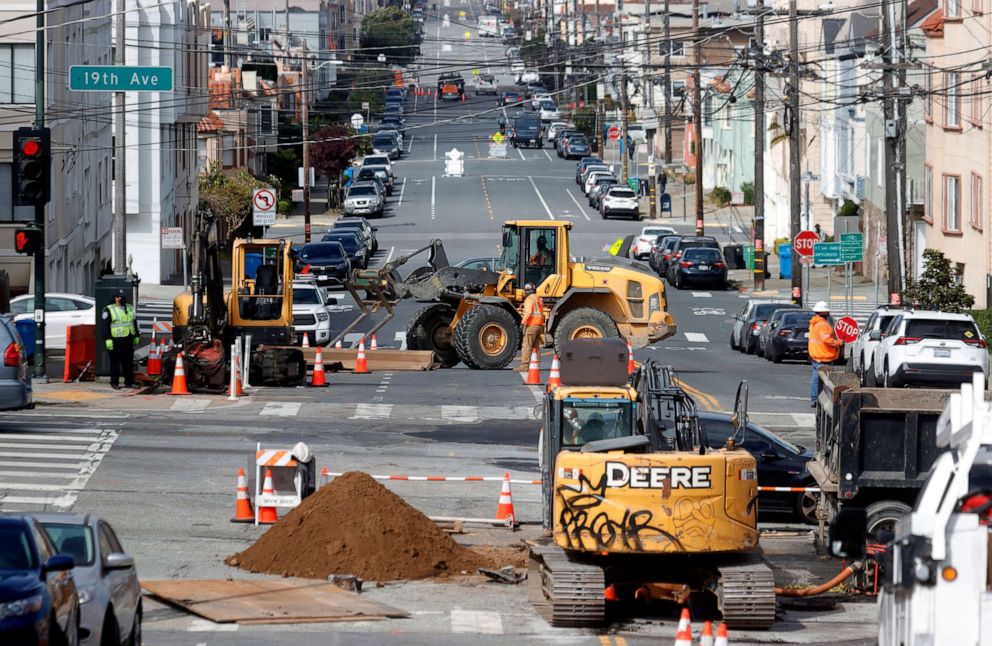 PHOTO: Workers operate a front loader as they make infrastructure repairs, April 7, 2021, in San Francisco.