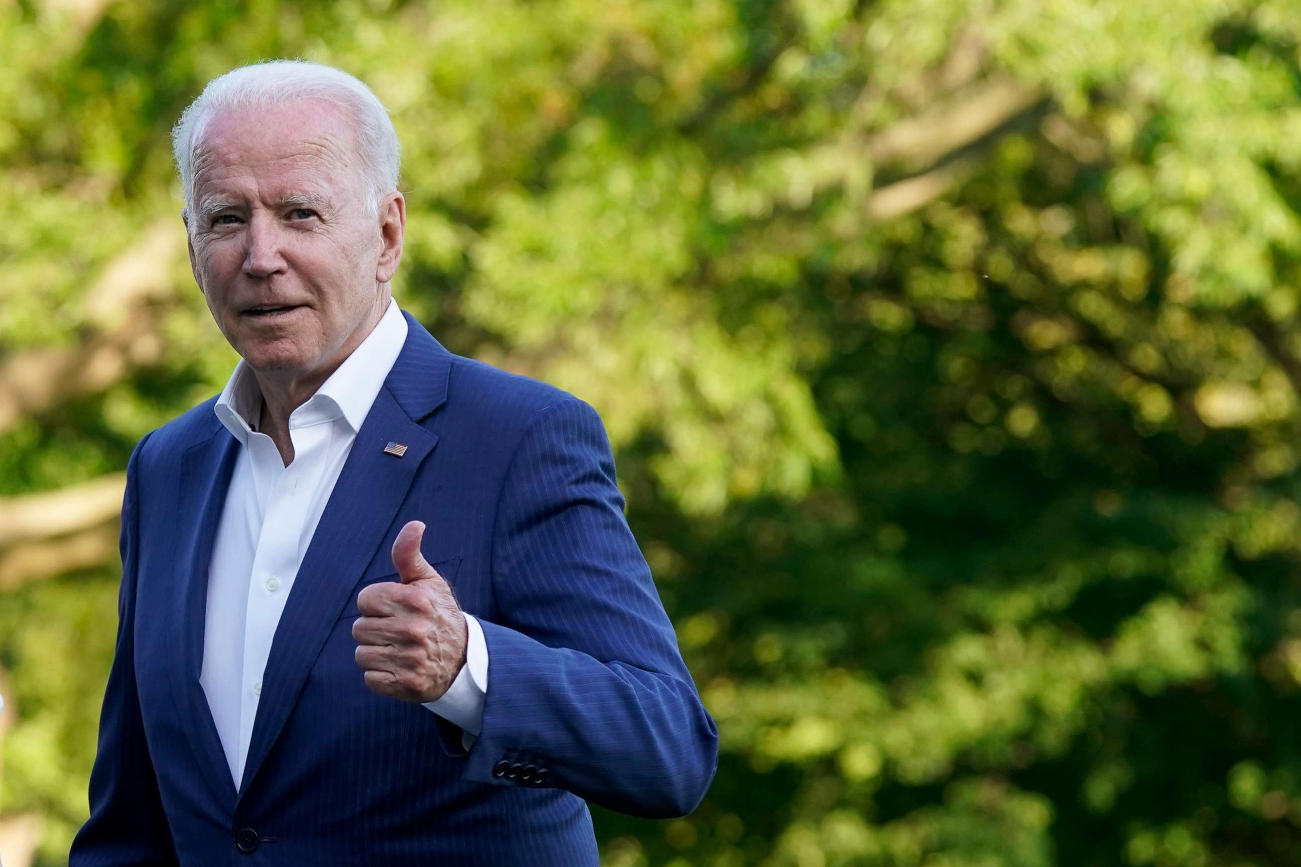 PHOTO: President Joe Biden gestures as he walks on the South Lawn of the White House after stepping off Marine One, Sunday, June 27, 2021, in Washington. Biden is returning from a weekend at Camp David. 