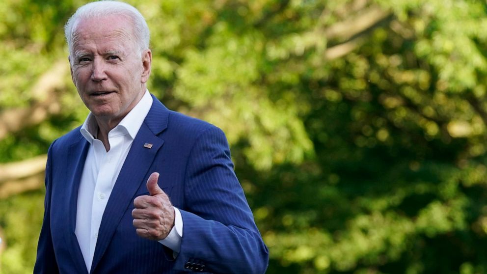 PHOTO: President Joe Biden gestures as he walks on the South Lawn of the White House after stepping off Marine One, Sunday, June 27, 2021, in Washington. Biden is returning from a weekend at Camp David. 