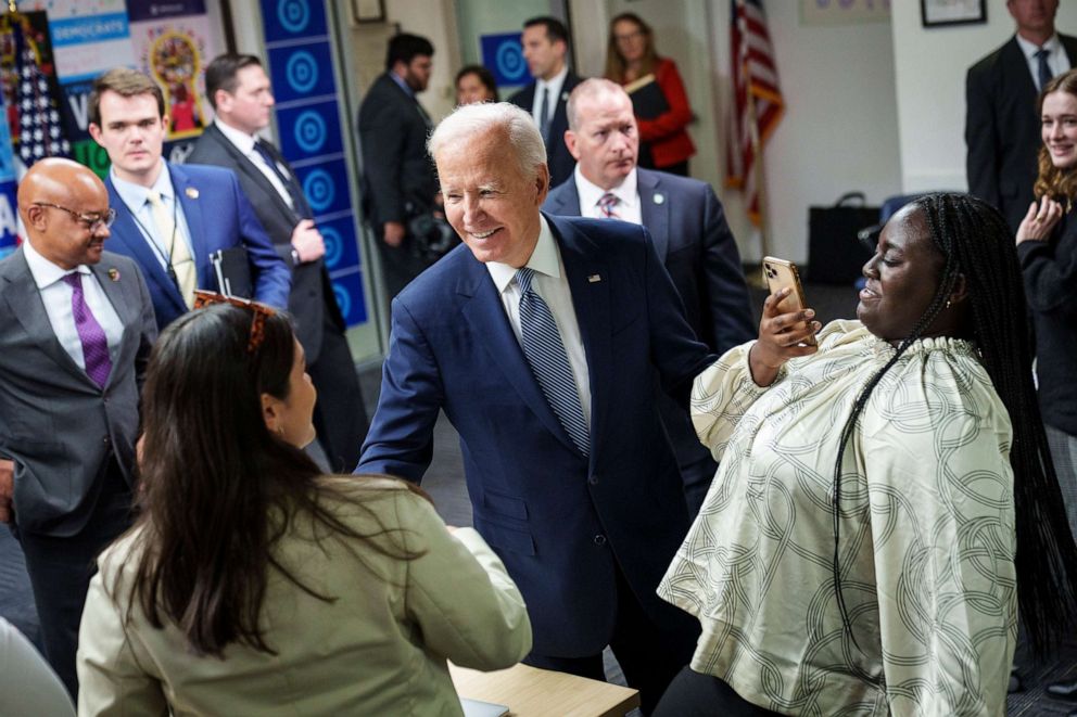PHOTO: President Joe Biden greets DNC staff and volunteers after speaking at the headquarters of the Democratic National Committee, Oct. 24, 2022, in Washington, D.C. 