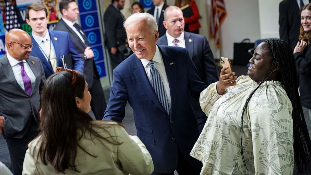 PHOTO: President Joe Biden greets DNC staff and volunteers after speaking at the headquarters of the Democratic National Committee (DNC), Oct. 24, 2022, in Washington, D.C. 