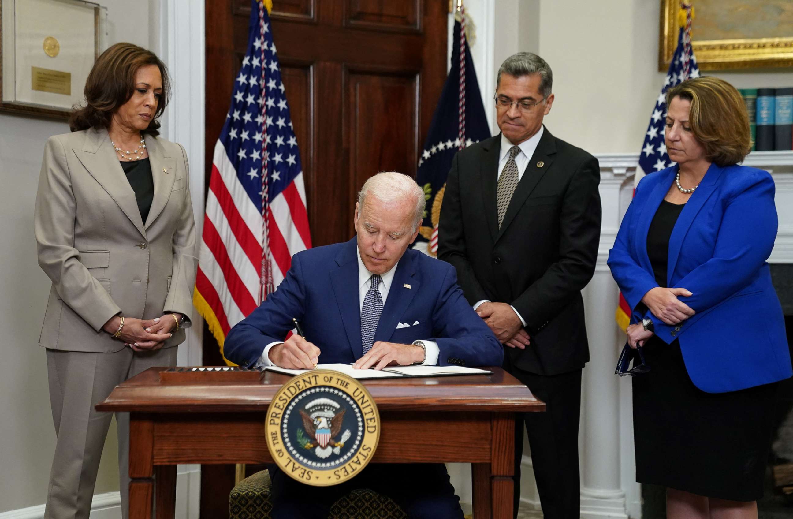 PHOTO: President Joe Biden signs an executive order to help safeguard women's access to abortion and contraception at The White House, July 8,2022, in Washington.S/Kevin Lamarque