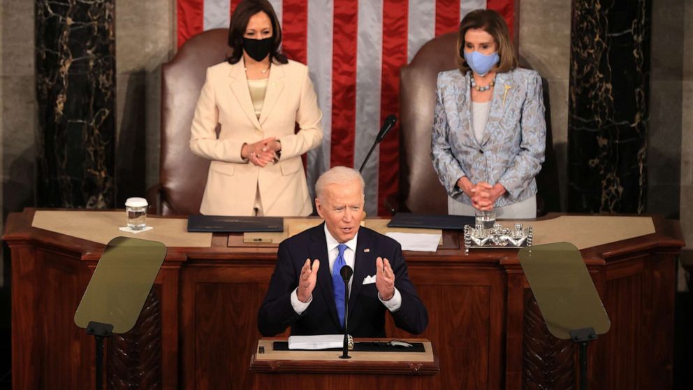 PHOTO: President Joe Biden addresses a joint session of congress as Vice President Kamala Harris and Speaker of the House Rep. Nancy Pelosi look on in the U.S. Capitol, April 28, 2021, in Washington.