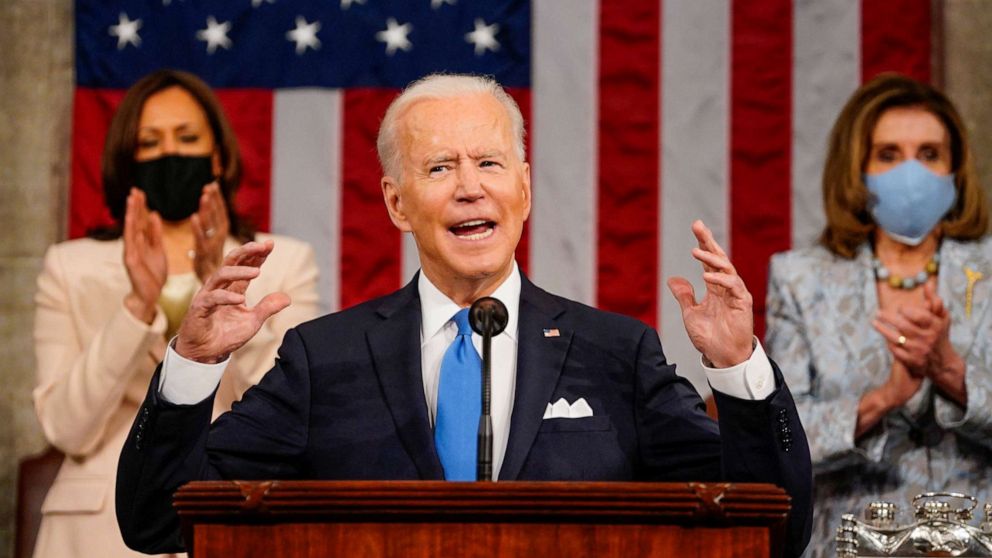 PHOTO: President Joe Biden addresses a joint session of Congress, with Vice President Kamala Harris and House Speaker Nancy Pelosi on the dais behind him, in Washington, April 28, 2021.