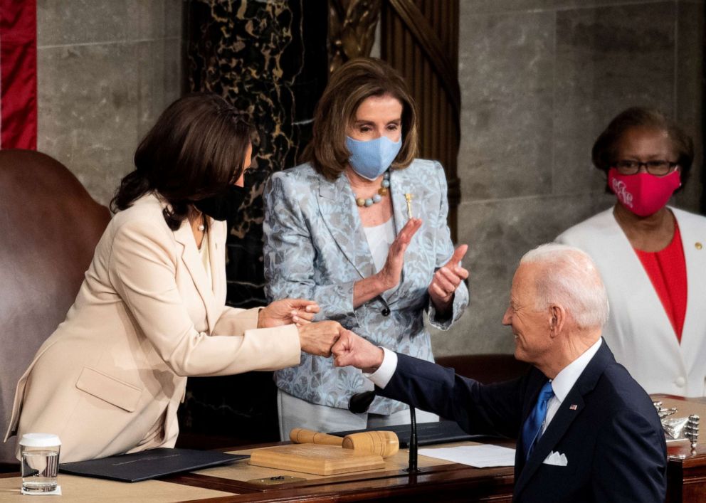 PHOTO: President Joe Biden fist bumps with Vice President Kamala Harris as Speaker of the House Nancy Pelosi claps at the end of his address to the joint session of Congress in the House chamber of the U.S. Capitol in Washington, April 28, 2021.