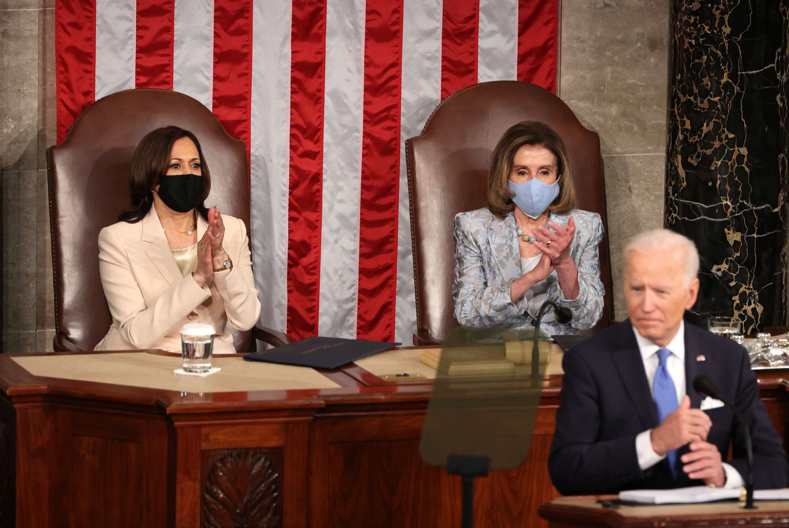 PHOTO: Vice President Kamala Harris and Speaker of the House of Representatives Nancy Pelosi applaud as President Joe Biden addresses a joint session of Congress at the U.S. Capitol in Washington, April 28, 2021.