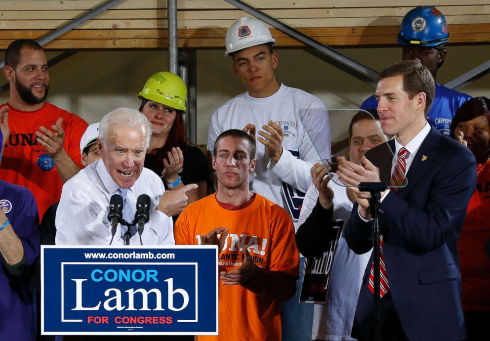 PHOTO: Former Vice President Joe Biden points at Conor Lamb, right, the Democratic candidate for the March 13 special election in Pennsylvania's 18th Congressional District, during a rally at the Carpenter's Training Center in Collier, Pa., March 6, 2018.
