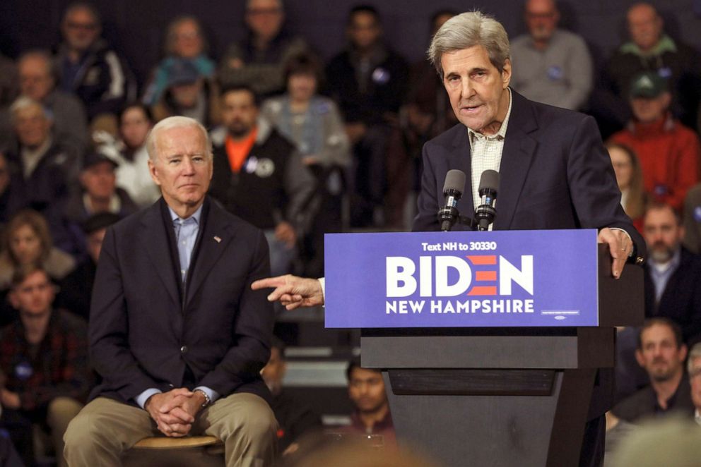 PHOTO: Democratic presidential candidate and former Vice President Joe Biden listens while John Kerry, the former secretary of state and 2004 Democratic presidential nominee speaks at a campaign event in Nashua, N.H., Dec. 8, 2019. 