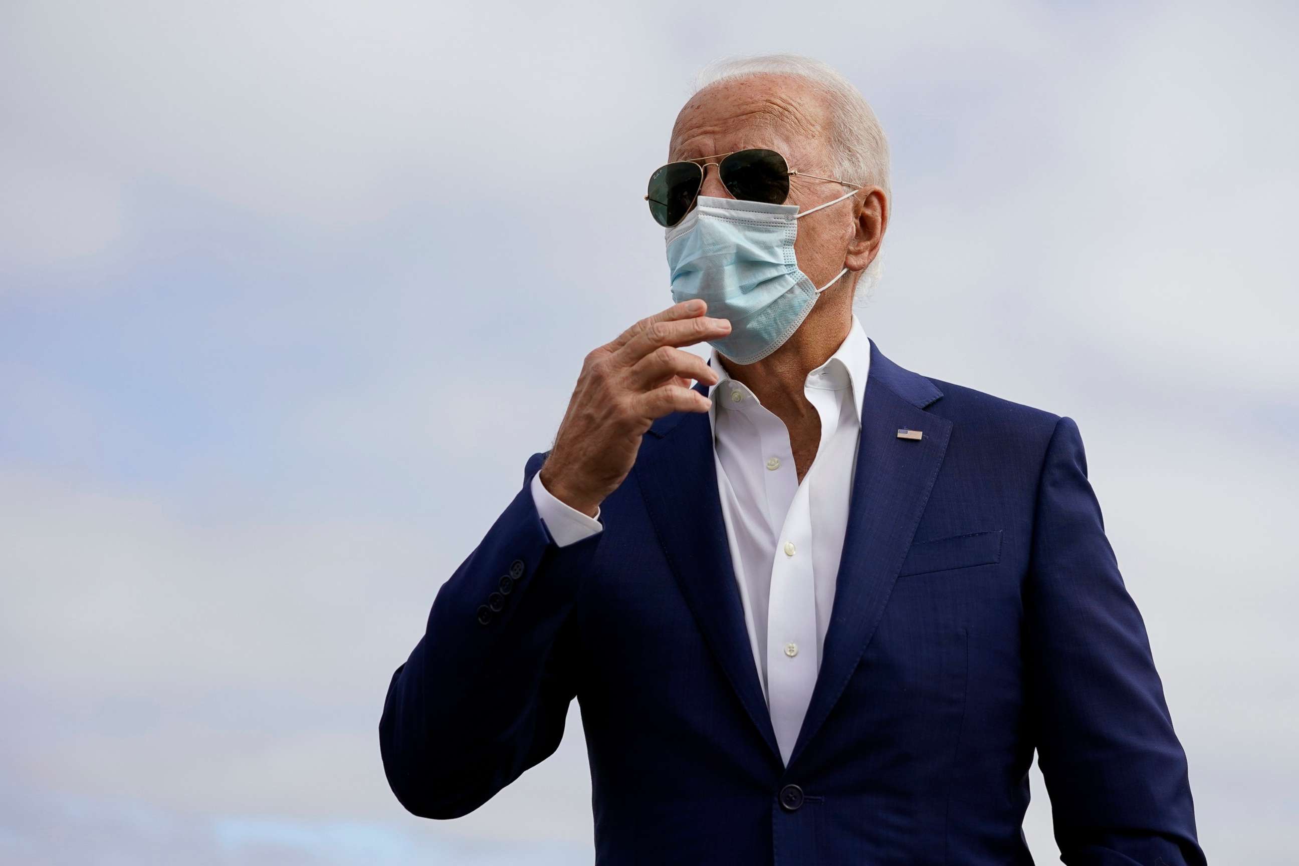 PHOTO: Democratic presidential candidate former Vice President Joe Biden speaks to members of the media before boardin his campaign plane at New Castle Airport, in New Castle, Del., Oct. 13, 2020, en route to Florida.