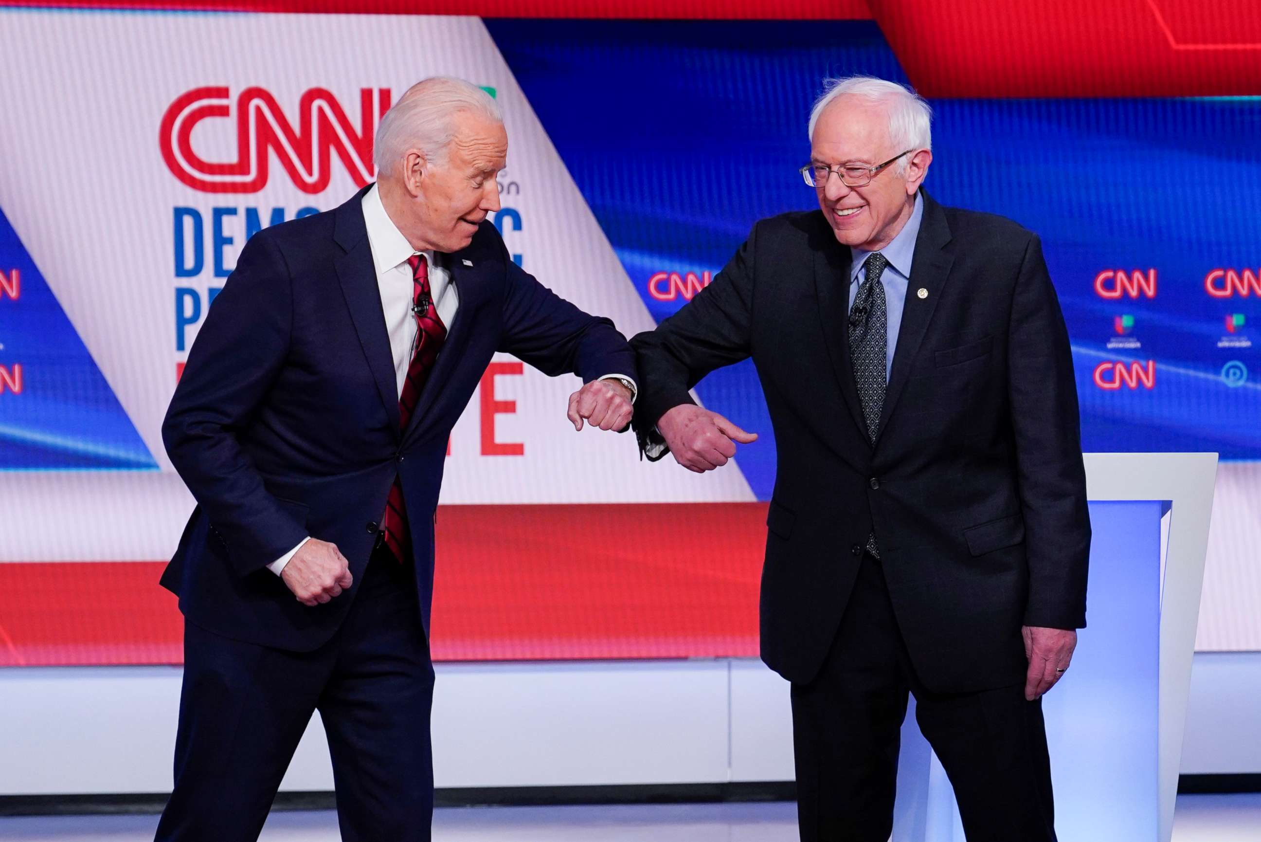 PHOTO: Former Vice President Joe Biden, and Sen. Bernie Sanders, greet one another before they participate in a Democratic presidential primary debate at CNN Studios in Washington, March 15, 2020.