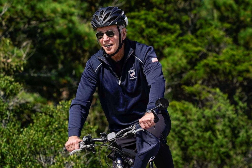 PHOTO: In this Sept. 19, 2021, file photo, President Joe Biden, takes a bike ride in Rehoboth Beach, Del.